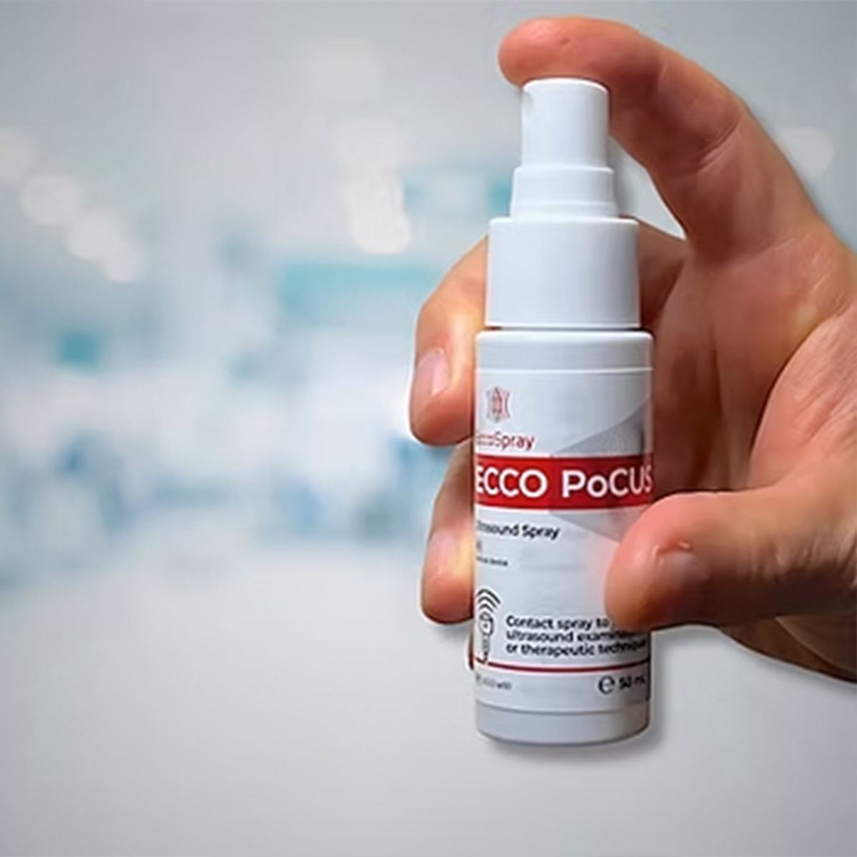 PoCUS Ultrasound Spray held by a hand